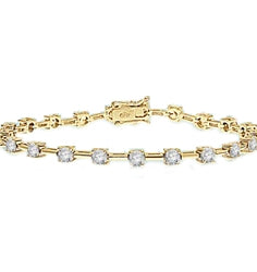 Charming bracelet to enhance your wrist play! 0.25 cts. Round Diamond Essence stones set apart with solid chain links. 3.0 Cts. T.W. set in 14K Solid Yellow Gold.