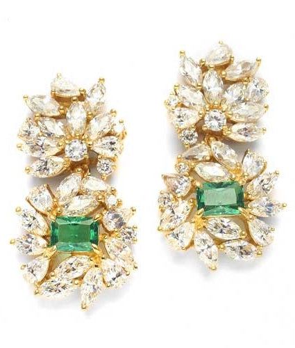 Designer earrings, just perfect for special occasions. Diamond Essence Emerald cut Emerald Essence, 1 ct. stone set in four prongs and surrounded by Marquise, Pear and Round Brilliant Essence stones in artistic floral design. 6.5 cts.T.W.