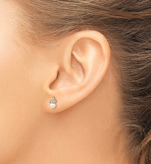 Diamond Essence Round Brilliant stone 0.10 ct each, set in group of three in floral arrangement and round freshwater cultured pearl makes a perfect post earrings for little ears. 0.60 cts.t.w. set in 14K Solid Yellow Gold.