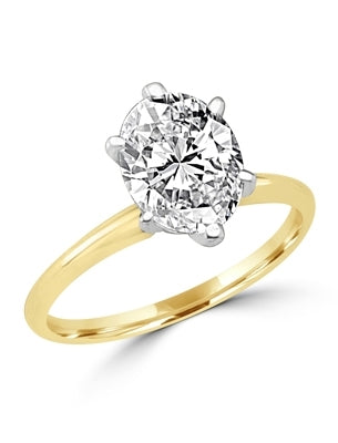 Ring with oval-cut stone set in 14k solid gold