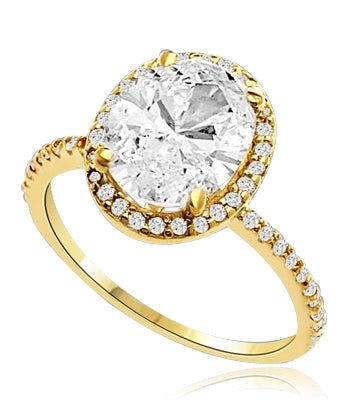 Beautiful Oval Centerpiece, 2.5 cts, is surrounded by Round Brilliant Melee in this elegant engagement ring. The band consists of round pointer melee to form a brilliant radiance. Appx. 3.5 Ct. T.W. In 14k Solid Yellow Gold.