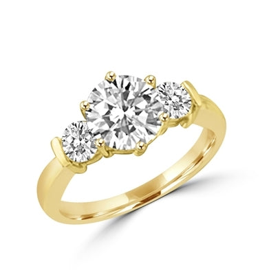 14K Solid Yellow Gold ring features a 2.0 ct. round cut Diamond Essence centerpiece rubbing elbows with two 0.3 round cut masterpices beside it. 2.6 cts. T.W. Breeding shows.