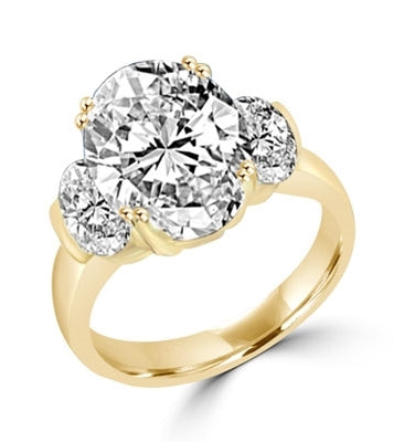 Ring oval cut stone in center and sides