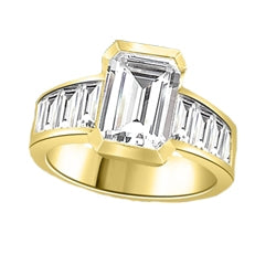 Escape with this Wide Band Ring with Channel Set Emerald Essence, 2.5 cts., separated by straight Diamond Bright Baguettes set vertically for a totally magnificent effect. 3.5 cts. T.W. set in 14K Solid Yellow Gold.