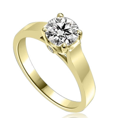 Diamond Essence Solitaire Ring Artistically set in wide band with a beautiful accent on both sides to enhance the looks set in 14K Solid Yellow Gold.
