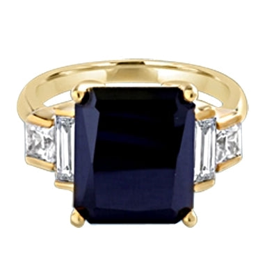 Onyx Ring - 6.0 Cts. Radiant Emerald cut Onyx Essence set in four prongs, accompanied by channel set Diamond Essence Baguettes and Princess cut stones on either side. 7.0 Cts.T.W. set in 14K Solid Yellow Gold.