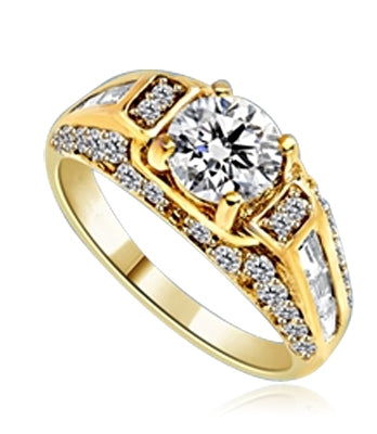 Engagement Ring- 1.0 Ct. round Brilliant Diamond Essence in center with Chanel set Baguettes and Melee going half way down the band. 2.0 Cts. T.W. set in 14K Solid Yellow Gold.
