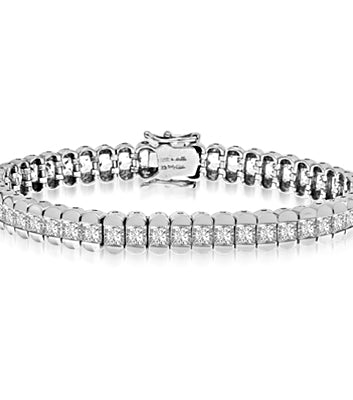 Platinum Plated Sterling Silver bracelet, 7" long, encompasses Diamond Essence Princess cut stones. 7.0 cts.t.w.