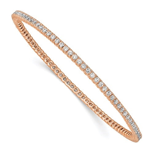An alluring prong-set slip-on bangle bracelet for women with simulated round brilliant Diamonds by Diamond Essence set in rose plated sterling silver. 4.65 Cts.t.w.
