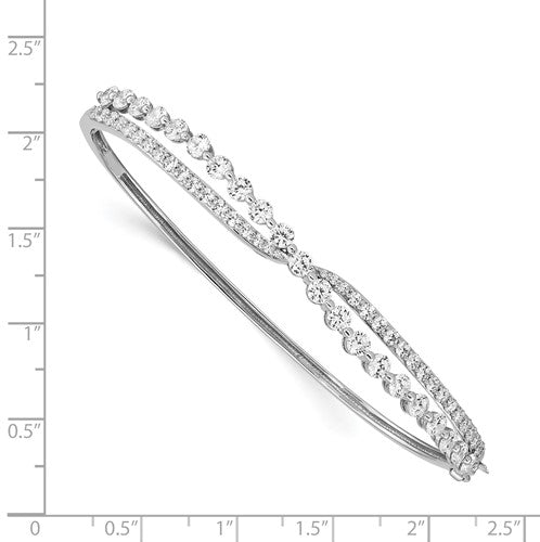 Beautiful designer hinged bracelet for ladies, in the criss-cross setting of round brilliant Diamond Essence stones, 2.75 cts.t.w. in platinum plated sterling silver. It will be highly noticed on your wrist for its beautiful shine and craftmanship.
