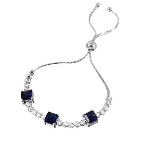 Diamond Essence Adjustable Bracelet with 1.0 ct. each Sapphire Princess cut stone in prong setting and 0.20 ct. each Round Brilliant stone in bezel setting. Beautiful bracelet to fit on any size wrist. 8.0 Cts.T.W. in Platinum Plated Sterling Silver.