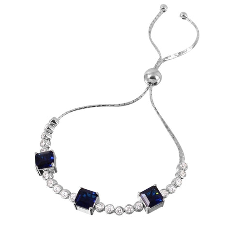 Diamond Essence Adjustable Bracelet with 1.0 ct. each Sapphire Princess cut stone in prong setting and 0.20 ct. each Round Brilliant stone in bezel setting. Beautiful bracelet to fit on any size wrist. 8.0 Cts.T.W. in Platinum Plated Sterling Silver.