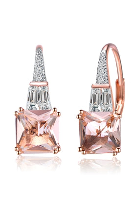 Diamond Essence Designer Earrings With 1.50 Cts. Morganite Cut Corner Princess Cut Stone And Tappered Baguettes Followed By Melee On Top, 3.50 Cts.T.W. In Rose Plated Sterling Silver.
​Approx Size Of Earrings Is 19mm Length And 7mm Width.