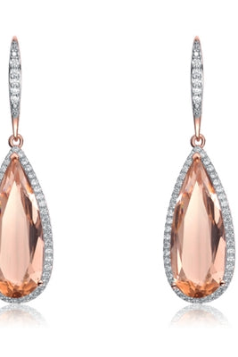 Diamond Essence Designer Leverback Earrings With Morganite Pear Essence Surrounded By Melee and Melee On the Bail, 12 Cts.T.W. In Rose Plated Sterling Silver.
​Approx Size 45mm Length And 13mm Width.