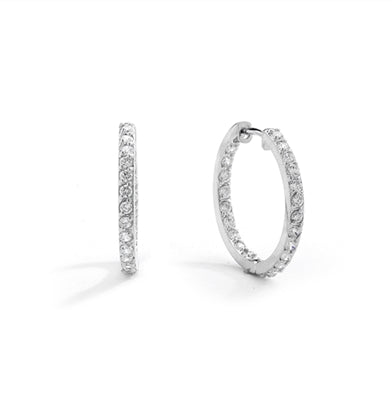 Platinum Plated Sterling Silver hoop earrings with a melee of Round cut Diamond Essence stones orbiting all around your delicate lobes. These highly flattering hoops are also hinged half way around so they can go on and come off in a flash. 2.0 cts.t.w.