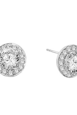Mini marvelous pair of six-prong set designer earrings with 2.25 Cts. each simulated oval cut center Diamond with round brilliant melee by Diamond Essence set in platinum plated sterling silver. 5.50 Cts.t.w