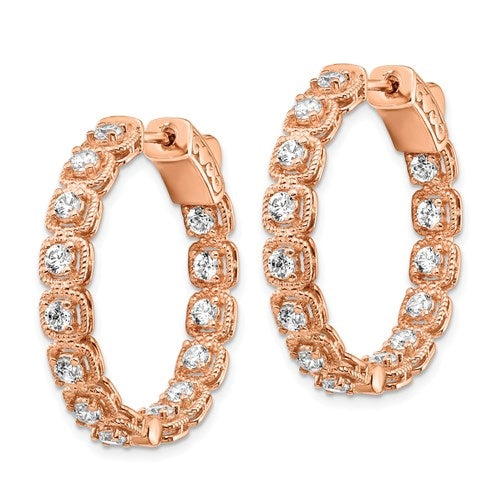 Diamond Essence Rose Plated Sterling Silver In and Out Hoop earrings 2.0 Cts.t.w. of Round brilliant Melee set in tension setting, with lock closure.
Length 28.5 mm and width 28.5 mm