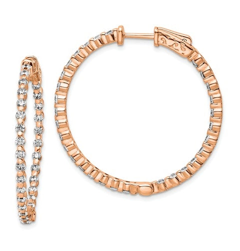 Diamond Essence Rose Plated Sterling Silver In and Out Hoop earrings 2.0 Cts.t.w. of Round brilliant Melee set in tension setting, with lock closure.
Length 35.5 mm and width 35.5 mm