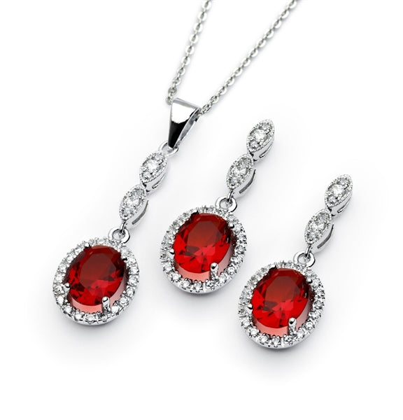 A marvelous pair of the four-prong set designer earring-pendant duo for women with oval-cut Ruby Diamond by Diamond Essence set in platinum-plated sterling silver. 5.0 Cts.t.w.