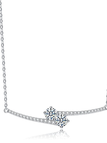 Diamond Essence U & ME Necklace, with two Round Brilliant stone set in four prongs in close connection, supported by melee on the sides. 2.25 Cts.T.W. in Platinum Plated Sterling Silver. Perfect for any occasion.