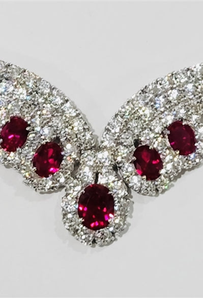 Magnificent Ruby Necklace. 3.0 Cts. Oval cut Ruby Essence in the center and 1.50 Cts. each Ruby Essence encircled by Diamond Essence stones. making 3 rows all around neckline. Special lock- on clasp to secure it. Just perfect to make any day a special day