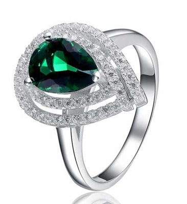 Diamond Essence Designer Ring With Emerlad Essence Pear Surrounded By Two Rows Of Round Brilliant Melee,2.50 Cts.T.W In Platinum Plated Sterling Silver.