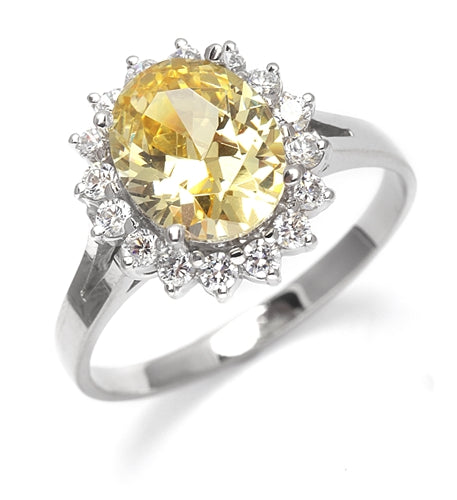 Light your Fire with this Cocktail Ring, 3.5 Cts T. W. with a 3 Cts. Oval Cut Diamond Essence Center and accents encircling the fireworks! In Platinum Plated Sterling Silver.
