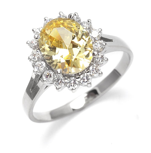 Light your Fire with this Cocktail Ring, 3.5 Cts T. W. with a 3 Cts. Oval Cut Diamond Essence Center and accents encircling the fireworks! In Platinum Plated Sterling Silver.