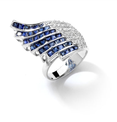 Wildfire - Art Deco Ring with burst of 36 Melee accents followed by 38 flaming Sapphire Essence princess cut jewels. 4.0 Cts. T.W. set in Platinum Plated Sterling Silver.