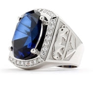 Tiger Imprinted with For the king of the jungle, this authoritative mens ring has a deep-blue oval Sapphire Essence, 5.45 cts., in the center, flanked by Diamond Essence melee in 14K White Gold, with tigers imprinted in Gold on either side. 8.45 cts. t.w