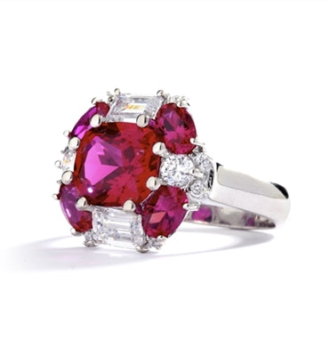 emerald cut and oval cut ruby stones with baguettes in silver ring