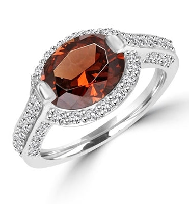 Diamond Essence designer ring with 2.5cts. Oval Chocolate Essence center surrounded by Round stones, 3.0ct. tw. in Platinum Plated Sterling Silver.
