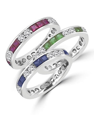 Best selling Eternity Bands with Princess Cut simulated Emeralds and Round Cut Diamond Essence stones all around the band. 1.5 Cts. T.W, in Platinum Plated Sterling Silver.