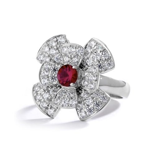 Stack of flowers - 0.65 Ct. Round Ruby Essence set in center of floral design Melee setting. 3.0Cts. T.W. set in Platinum Plated Sterling Silver.