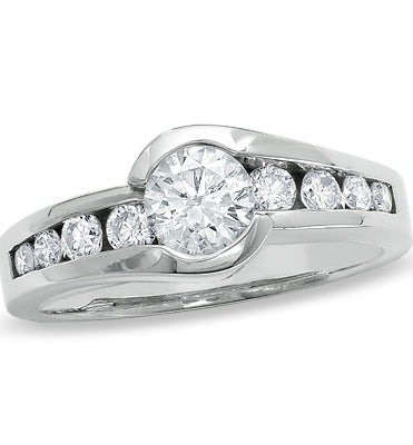 Designer Ring with channel set, 1.0 Cts. Round Brilliant Diamond Essence in center accomapnied by graduating melee on either side, 1.30 Cts. T.W. set in Platinum Plated Sterling Silver.
