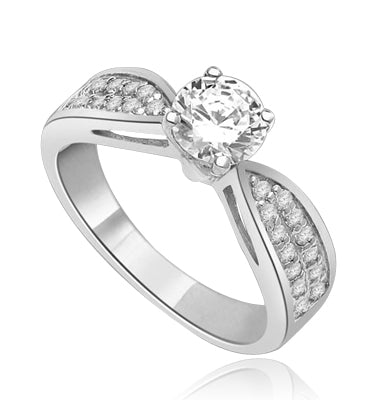 Sexy and Stylish 0.75 Ct. Round Stone Ring with deep channel set round accents on the band. 1.25 Cts. T.W. In Platinum Plated Silver.