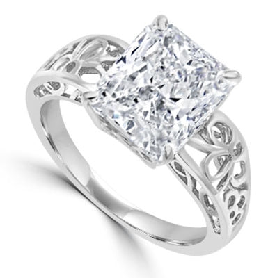 In this finely created ring, a 4 Ct. Radiant Emerald White Brilliant Stone is crafted atop an ethic set wide band. In 14k Gold Vermeil.