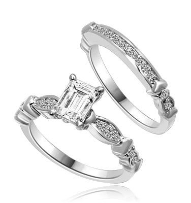 Beautiful Wedding Set with 1.0 Ct. Emerald cut Emerald Essence set in center accompanied by Melee on either side and on the matching band. 1.50 Cts. T.W. set in Platinum Plated Sterling Silver.