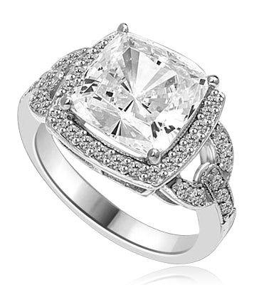 Diamond Essence designer ring 4.0 cts. Cushion cut Diamond essence set high in the center with melee around and on the band. 4.5 cts.t.w in Platinum Plated Sterling Silver.