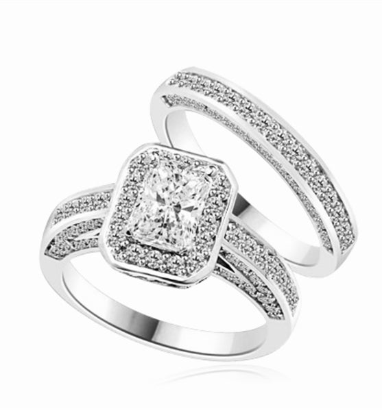 Wedding Set - 1.0 Ct. Radiant Emerald cut Diamond Essence center with Melee around and flowing down the band. Matching band with Melee, 2.75 Cts. T.W. set in Platinum Plated Sterling Silver.