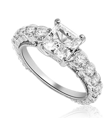 Engagement Ring With Princess Cut Diamond Essence Set in Center accompanied by Round Brilliant Diamond Essence going down the band. 3.25 Cts. T.W. set in Platinum Plated Sterling Silver.