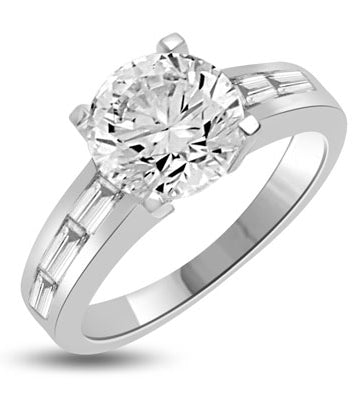 Baguetted Beauty! 1.25 Cts. Round Brilliant Diamond Essence mounts on top pf elegant Baguettes on the band. Appx. 2.5 Cts. T.W.