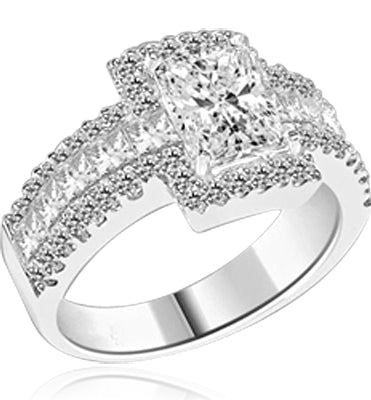 Engagement Ring - 1.75 Cts. Radiant Emerald cut Diamond Essence set in center surrounded by Round Melee and Princess cut Diamond Essence, which flows on band also, making three shinning rows on either side. 5.0 Cts. T. W.