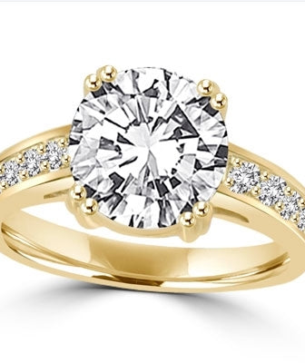 ring with 2.5ct stone in center and four round stones on sides