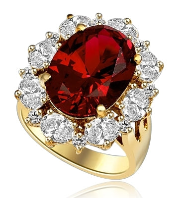 Gorgeous Ring with 8.25 Cts. Oval Cut Ruby Essence in center, surrounded by Oval cut Diamond Essence and Round Brilliant Melee. 10.25 Cts T.W. set in 14K Gold Vermeil.
