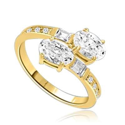 Two Oval Essence, 1.0 ct. each, set in four prongs and accompanied by baguettes and melee on band. 2.5 Cts. T.w. In 14k Gold Vermeil.