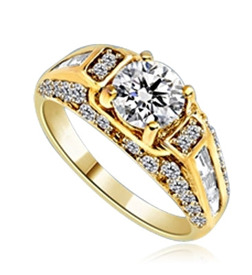 Engagement Ring- 1.0 Ct. round Brilliant Diamond Essence in center with Chanel set Baguettes and Melee going half way down the band. 2.0 Cts. T.W. set in 14K Gold Vermeil.