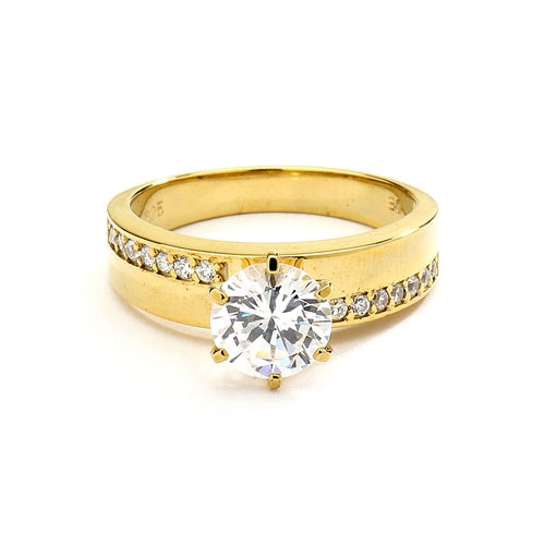 Diamond Essence Ring with 2.0ct. Round brilliant stone set in six prongs with round stones on each side, 2.5cts. T.W. set in 14K Gold Vermeil.
