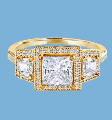 Diamond Essence Ring with 1.5ct. Princess Cut stone set in four prongs with baguettes on each side surrounded by round stones, 2.5ct.T.W. set in 14K Gold Vermeil.