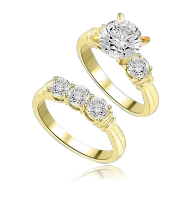 Wedding Ring Set with 2 Ct. Round Brilliant Center and 1.25 Ct. Accent Stones. The Wide Prong is Two Tone to enhance the beauty! 3.25 Cts.T.W. In 14k Gold Vermeil.